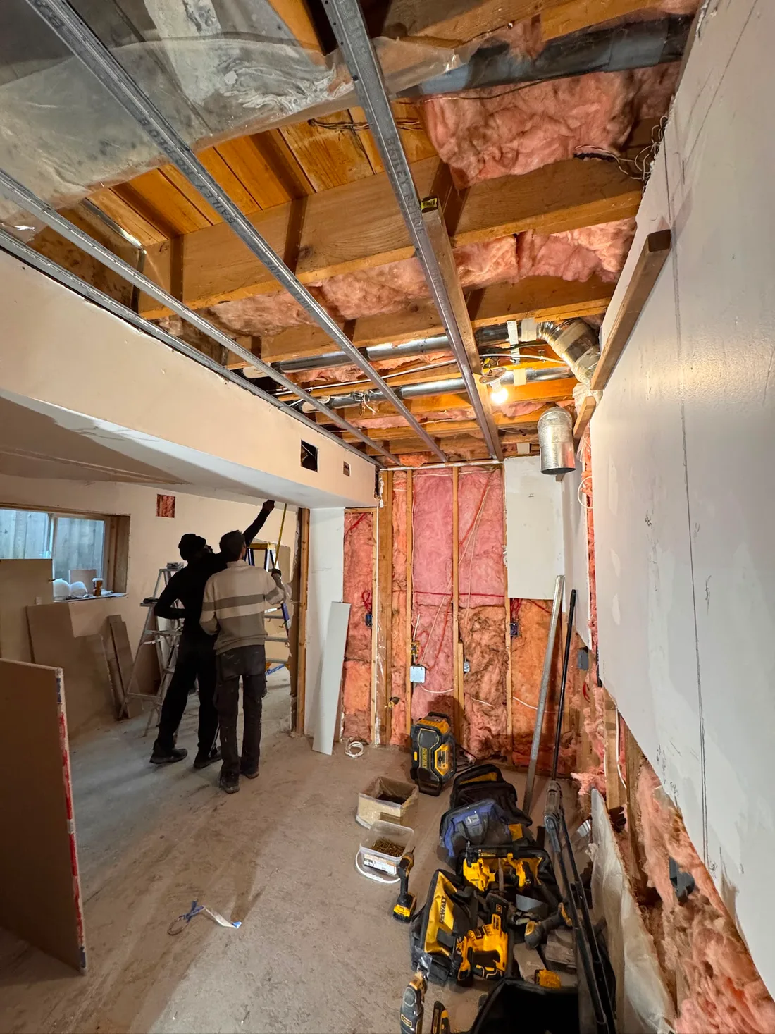 Interior ceiling opened for insulation, framing, and mechanical coordination